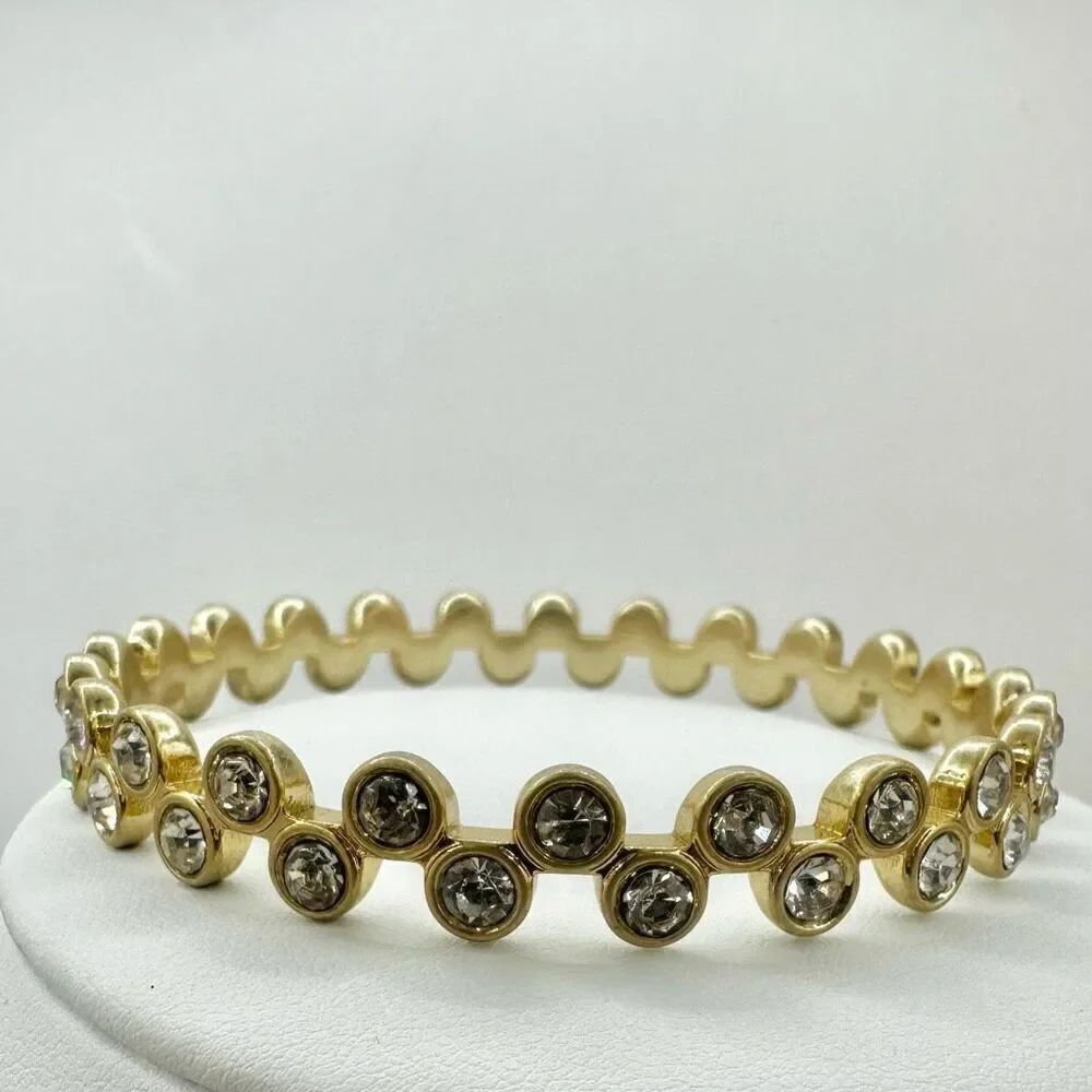 Gold tone and rhinestone bangle bracelet